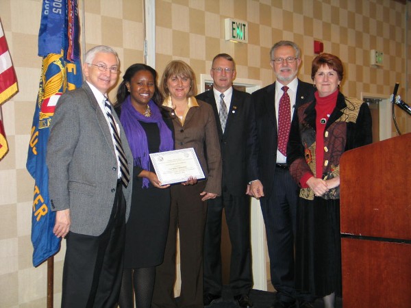 In December, Duvall (3rd from l) presents the Civilian Cyber Professional Award to Verlaine Quinniey (2nd from l), Old Dominion University Student Chapter. Witnessing the presentation are Dr. Stephen Gordon (l); Vanderlip (3rd from r); Whit Ludington, chapter president; and Penny Pickle.